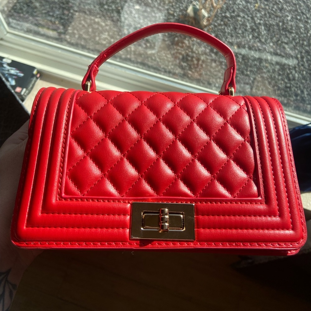 Red clutch bag w gold chain